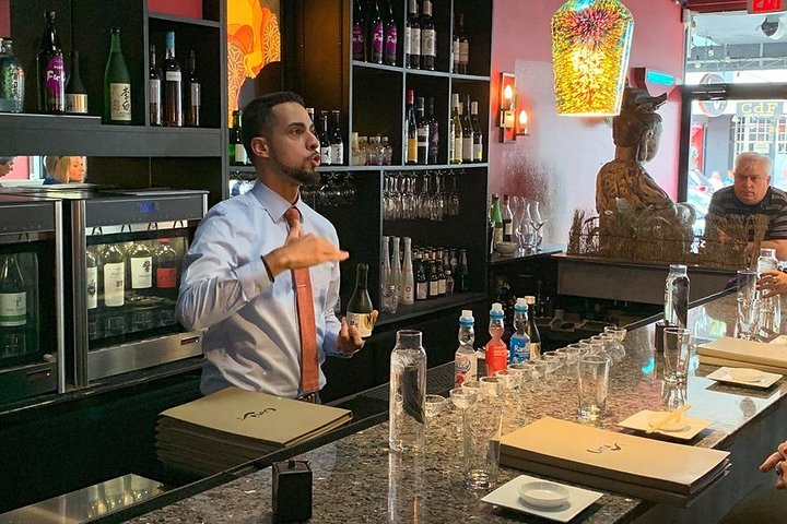 Jose explains how sake is made before tasting some.